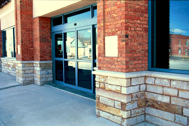 Architect: Verkaik & Associates, Canon City, CO. Installation: Mountain Masonry, Canon City, CO. Description: 4 x 4 in. Strip Stone Sienna Buff and Grey full thickness stone veneer.