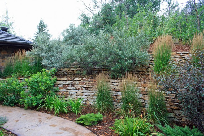 Landscape Design and Installation: Fredell Enterprises, Colorado Springs, CO. Description: Wall Stone 2-4’ and 3-5’ hand stacked retaining walls.
