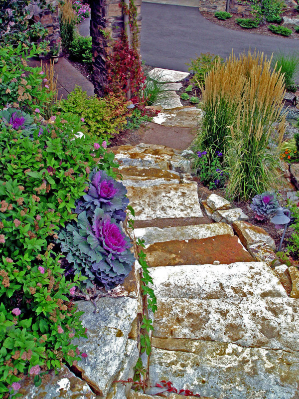 Natural stair treads with Wall stone on left and small Cinnamon Shadow Quarry Boulders on the right.